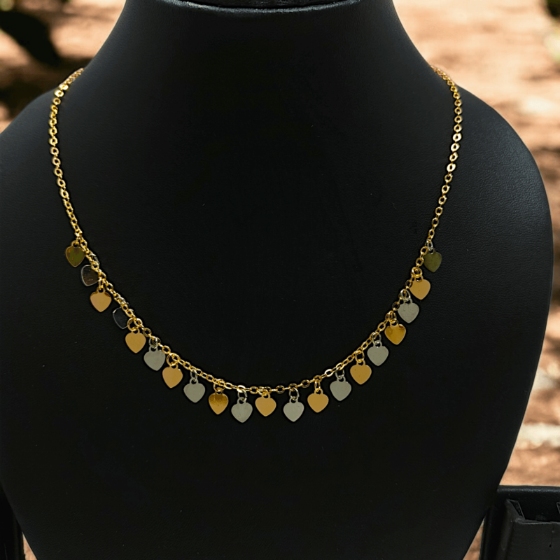 Gold Necklace Featuring a Heart Charm