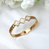 Gold Bracelet with White Flowers.